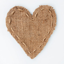  Symbolic Heart Of Burlap Lies On A White Background