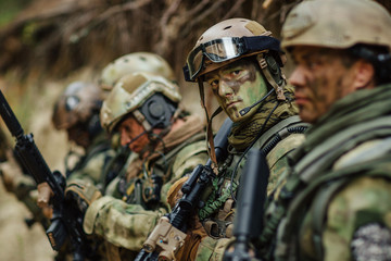 Wall Mural - soldier aims his weapon in sight