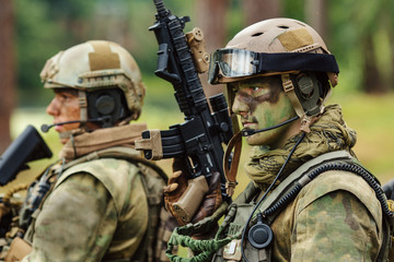 Poster - soldier stands with arms and looks forward