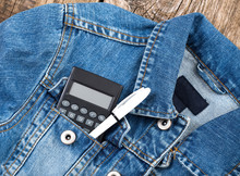 Student Calculator And Pen In Jeans Jacet Pocket