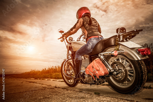 Obraz w ramie Biker girl on a motorcycle