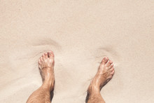 Wet Male Feet Stand On White Sand