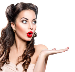 Wall Mural - surprised woman showing empty copy space on the open hand