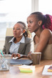 © Milles Studio - Businesswomen interacting at office