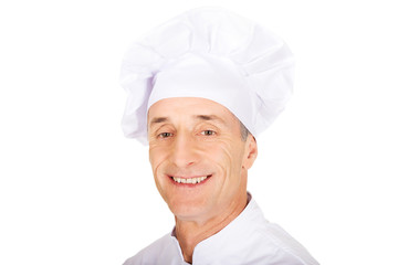 Wall Mural - Professional chef in white uniform and hat