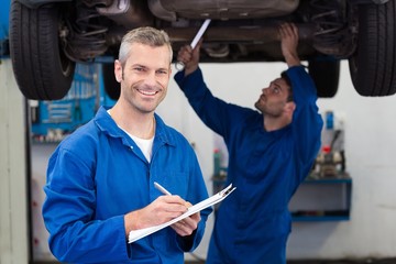 Poster - Team of mechanics working together