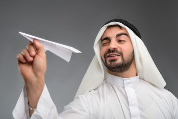 Wall Mural - Arab businessman with paper airplane