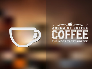 Fototapete - Coffee cup icon and text design with a blurred background.