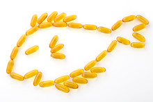 Fish Oil Composed In Fish Shape On Background