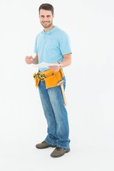 Poster - Smiling construction worker holding clipbard