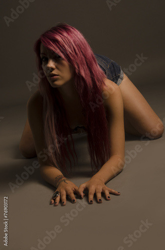 Junge Frau auf allen Vieren Buy this stock photo and explore similar