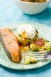 the fried salmon with a potato patty and poached egg