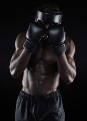 Wall Mural - Young male boxer blocking