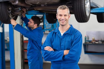 Poster - Team of mechanics working together