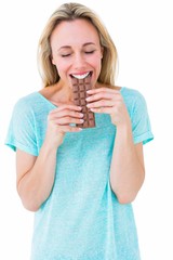 Poster - Happy blonde eating bar of chocolate