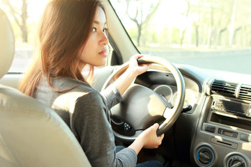 young bussinesswoman driving a car