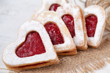 Heart Shaped Cookies With Jam For Valentine's Day On Textile