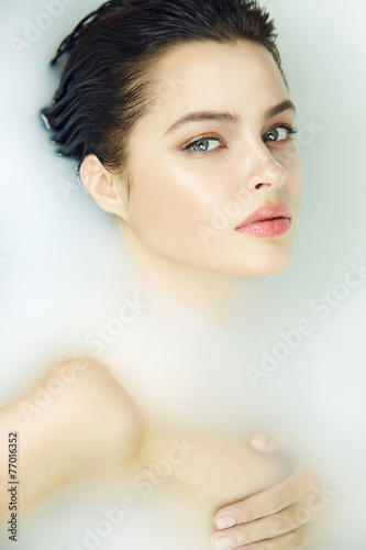 Naklejka - mata magnetyczna na lodówkę Beautiful sexy woman in bath with milk spa cosmetic body .