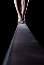 Feet Of Gymnast On Balance Beam