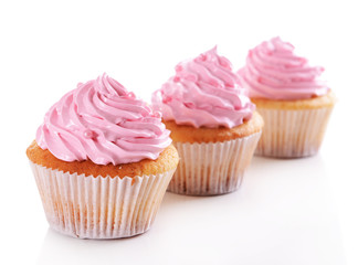 Wall Mural - Delicious cupcakes isolated on white