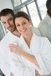 © goodluz - Portrait of couple in bathrobe spa center relaxation room