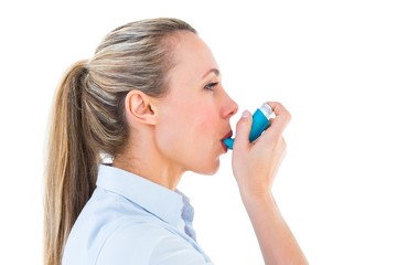 Poster - Pretty blonde using an asthma inhaler