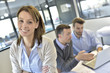 © goodluz - Portrait of businesswoman attending meeting