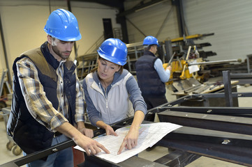 Industrial people meeting together in factory