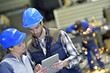 © goodluz - Engineers in steel factory working on digital tablet