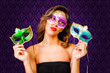 Attractive girl with masks of different colors