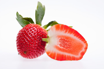 Wall Mural - cut red  strawberry isolated on white background
