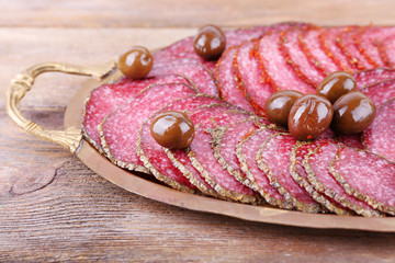 Wall Mural - Slices of salami with olives