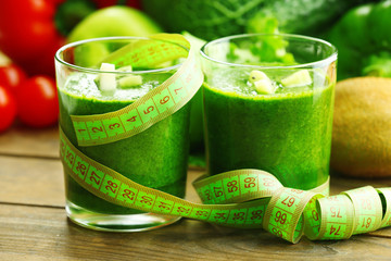 Green fresh healthy juice with fruits and vegetables