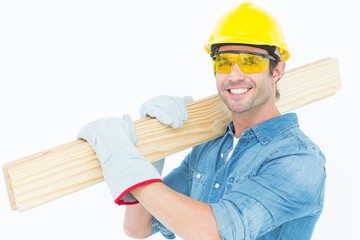 Poster - Carpenter wearing hardhat and glasses while carrying planks