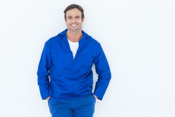 Poster - Happy mechanic with hands in pockets