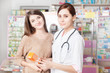 © DC Studio - Pharmacist with client inside pharmacy