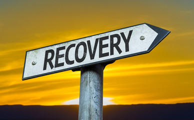 Recovery sign with a sunset background