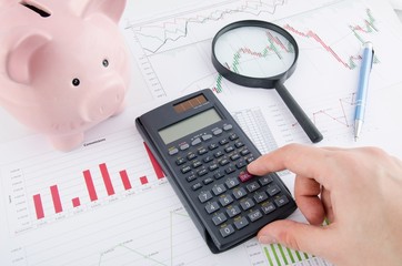 Man working with documents and calculator. Saving money business