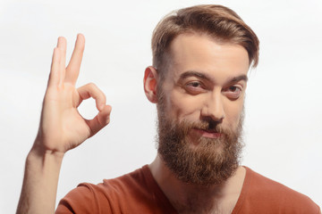 Handsome bearded man posing on white