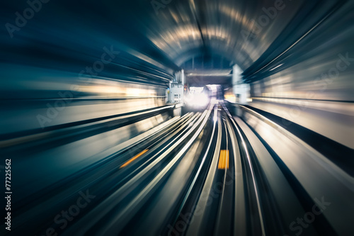 Fotografie, Obraz Subway tunnel with blurred light tracks with arriving train