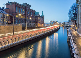 Canvas Print - Light trails from traffic passing through city.