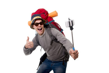 young traveler backpacker taking selfie photo with stick