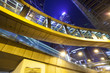 © zhu difeng - pedestrian bridge and city buildings at night