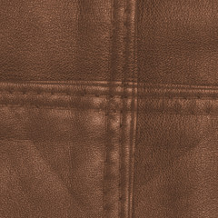 Canvas Print - yellow-brown  leather texture, seams in form ol cross