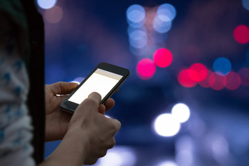 Using cellphone at night while crossing the street.