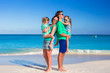 © travnikovstudio - Young happy family with two kids on summer vacation