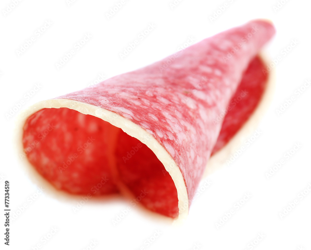 Slice of salami isolated on white background