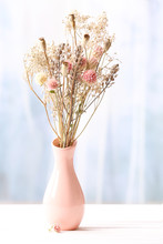 Bouquet Of Dried Flowers In Vase On Light Background