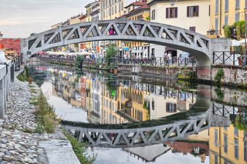 Fototapete - Bridge across the Naviglio Grande canal