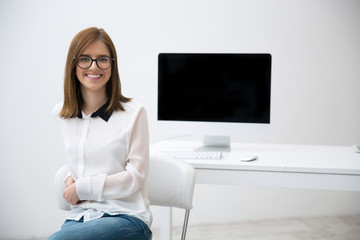 Canvas Print - Happy smiling business woman in glasses at office